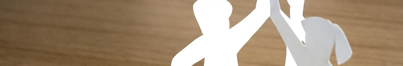 Paper figure high-fiving