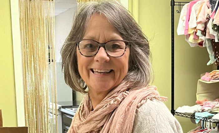 A volunteer smiling.